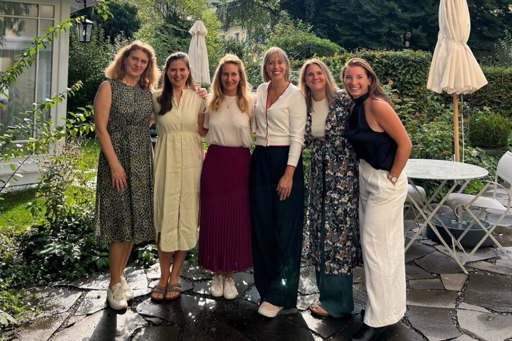 A community gathering of women in a garden
