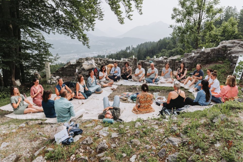 Participants gathered in a circle outdoors during a retreat