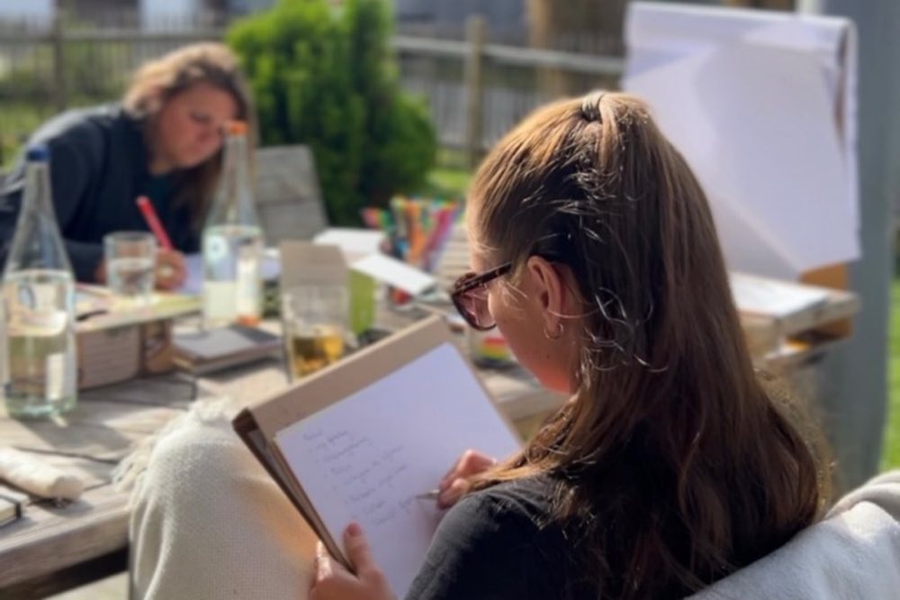 A participant sketching during a workshop