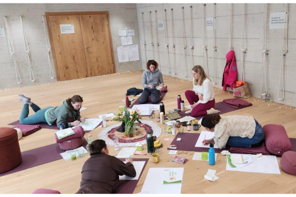 Participants seated and working together in a workshop room