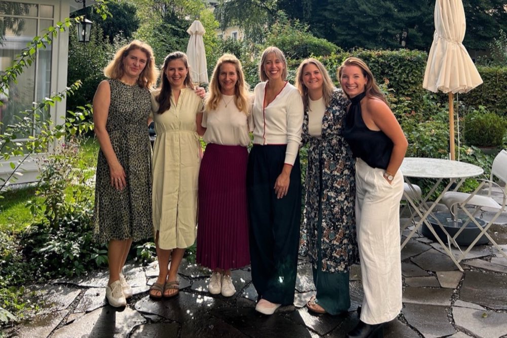 A group of women together in a garden
