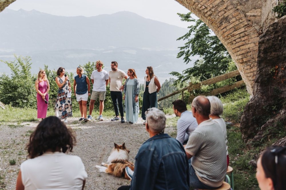 Participants gathered outdoors in conversation